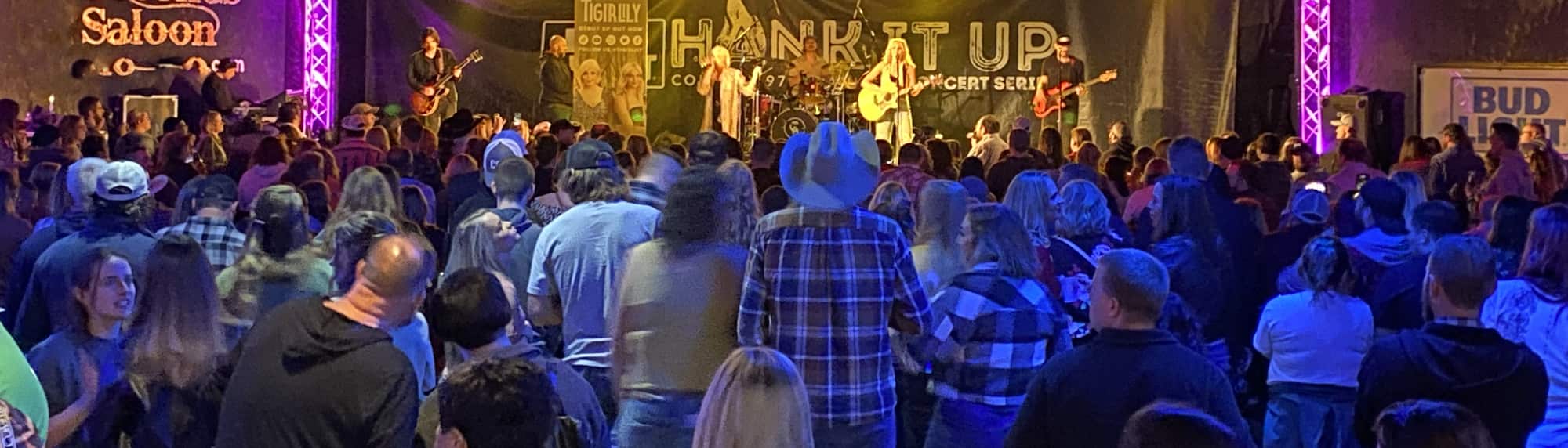 country concert with fans wearing cowboy hats Chattanooga
