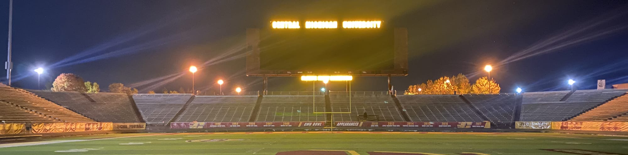 empty football stadium at night under the lights Chattanooga